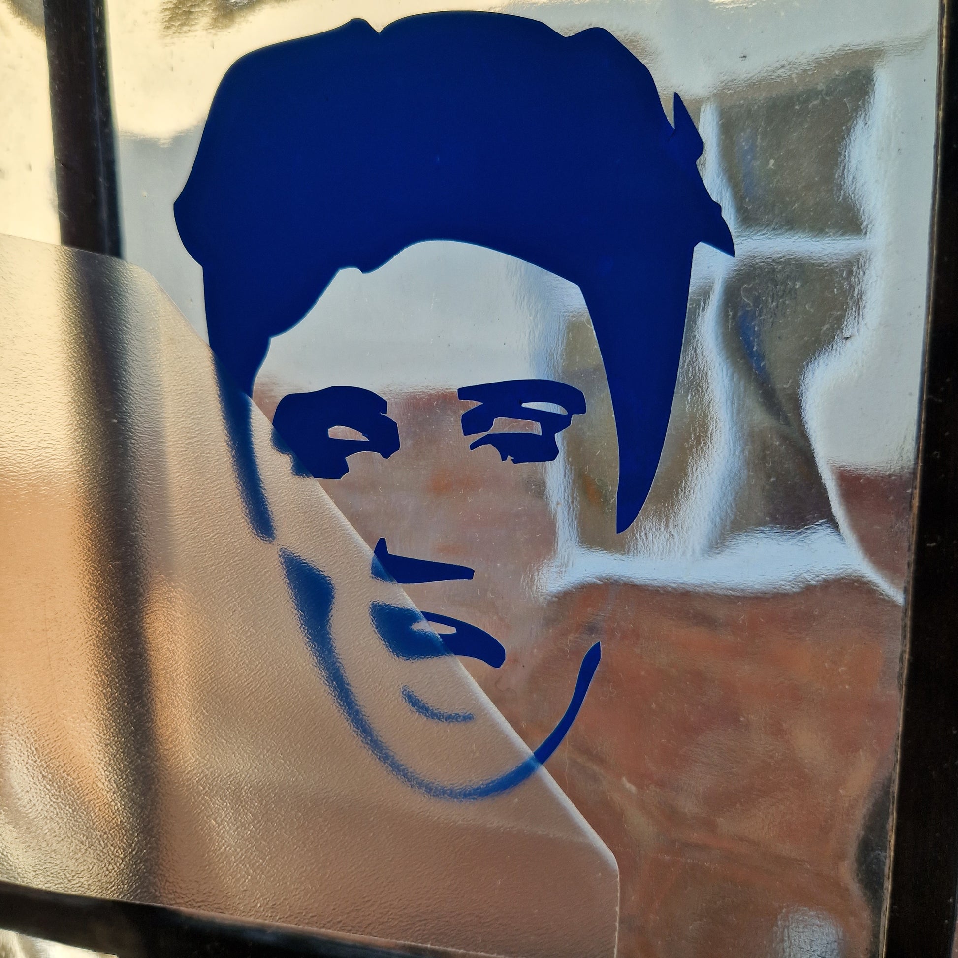 elvis presley decal being transferred onto textured glass