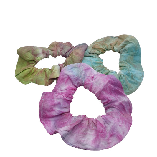 tie dyed hair scrunchies in an assortment of colours, showing teal, green and pink